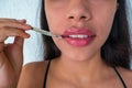 Close-up of a woman`s hands with a syringe The young and lovely woman undergoes a lip augmentation procedure. Concept of beauty