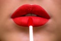 Close-up of woman`s lips with fashion make-up. Trend Lips Makeup with bright red Color Lipstick. Woman Applying Fashion lip Make- Royalty Free Stock Photo