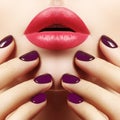 Close-up of woman`s Lips with Fashion pink Make-up and Manicure on Nails. Beautiful female full lips with perfect Makeup