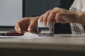 Close up on woman`s notary public hand stamping the document. Notary public concept