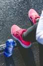 Close up of womanÃÂ´s sports shoes. Young woman have a rest on stairs. Healthy lifestyle. Fitness sport. Cardio training. Royalty Free Stock Photo