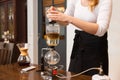 Close up of woman with siphon coffee maker and pot Royalty Free Stock Photo