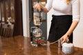 Close up of woman with siphon coffee maker and pot Royalty Free Stock Photo