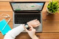 Close up of woman with smart watch and laptop Royalty Free Stock Photo