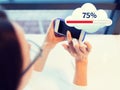 Close up of woman with smartphone cloud computing