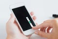 Close up of woman with smartphone doing blood test