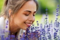 Close up of woman smelling lavender flowers Royalty Free Stock Photo