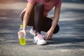Close-up of woman sport athletes and electrolytes. Asian woman dehydrated sweating after outdoor running exercise