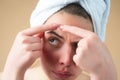 Close up Woman squeeze out pimples on forehead. Acne and pimple on skin. Dermatology, puberty woman. Pimples problem Royalty Free Stock Photo