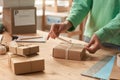 Woman decorating gift boxes