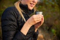 Close Up Of Woman Taking A Break From Countryside Hike And Drinking Coffee From Flask Royalty Free Stock Photo