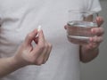 Close up of woman taking in pill, Medicine, health care and people concept Royalty Free Stock Photo