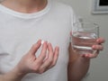 Close up of woman taking in pill, Medicine, health care and people concept Royalty Free Stock Photo