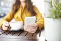 Close up of woman texting on smartphone at cafe Royalty Free Stock Photo