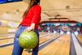 Close up of woman throwing ball in bowling club Royalty Free Stock Photo