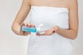 Close-up woman in towel holding cotton pad and makeup remover Royalty Free Stock Photo