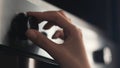 Close-up of woman turning oven handle. Concept. Woman switches modes on oven panel for baking. Woman sets up oven for