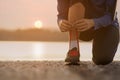 Close up woman tying shoe laces