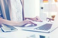 Close up of a woman typing at laptop Royalty Free Stock Photo