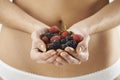 Close Up Of Woman In Underwear Holding Fresh Summer Berries