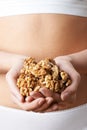 Close Up Of Woman In Underwear Holding Handful Of Walnuts