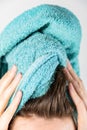 Female drying her hair with towel Royalty Free Stock Photo