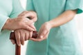 Close-up of woman using cane