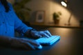 Close Up Of Woman Using Computer At Home At Night With Fingers Typing On Keyboard Royalty Free Stock Photo