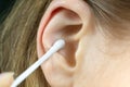 Close up, Woman using Ear cotton swabs. Hygienic ears sticks Royalty Free Stock Photo