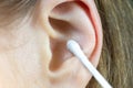 Close up, Woman using Ear cotton swabs. Hygienic ears sticks Royalty Free Stock Photo