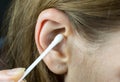 Close up, Woman using Ear cotton swabs. Hygienic ears sticks Royalty Free Stock Photo