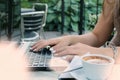 Close up of a woman using laptop computer at outdoor cafeteria Royalty Free Stock Photo