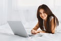 Close-up of Woman using laptop on her bed Royalty Free Stock Photo