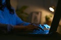 Close Up Of Woman Using Laptop At Home At Night With Fingers Typing On Keyboard Royalty Free Stock Photo