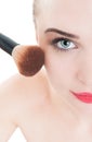 Close-up with woman using make-up brush