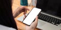 Close up of woman using mobile smart phone with blank white screen, Phone with black screen mockup. Royalty Free Stock Photo