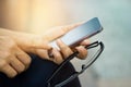 Close up of a woman using mobile smart phone outdoor and glasses Royalty Free Stock Photo