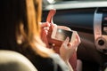 Close up woman using phone for navigator in car Royalty Free Stock Photo