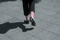 Close-up of a woman walking on the street with fashion socks