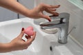 close up woman washing hands with soap and water, white foam, in the bathroom, under tap in the sink Royalty Free Stock Photo