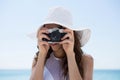 Close up woman wearing hat while photographing Royalty Free Stock Photo