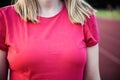 close up of woman wearing red t-shirt