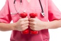 Close-up of woman wearing scrubs training with weights Royalty Free Stock Photo