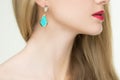 Close up of woman wearing shiny diamond earrings Royalty Free Stock Photo