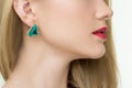 Close up of woman wearing shiny diamond earrings Royalty Free Stock Photo