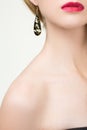 Close up of woman wearing shiny diamond earrings Royalty Free Stock Photo