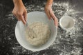 Woman whisking flour in bowl