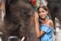 Close-up of the woman who hugs the elephant`s head