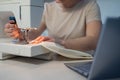 Close-up. A woman works on an electric sewing machine at home Royalty Free Stock Photo