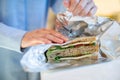 Close Up Of Woman Wrapping Sandwich In Non Reusable Aluminium Foil Royalty Free Stock Photo